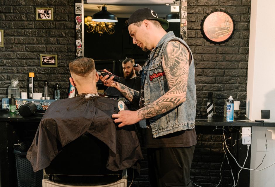 Barber giving a client a precision haircut